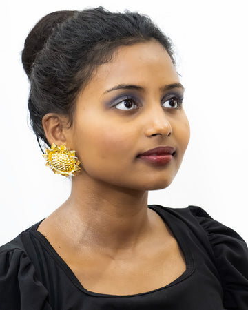 Gold-plated floral earrings with cubic zirconia stones, statement style